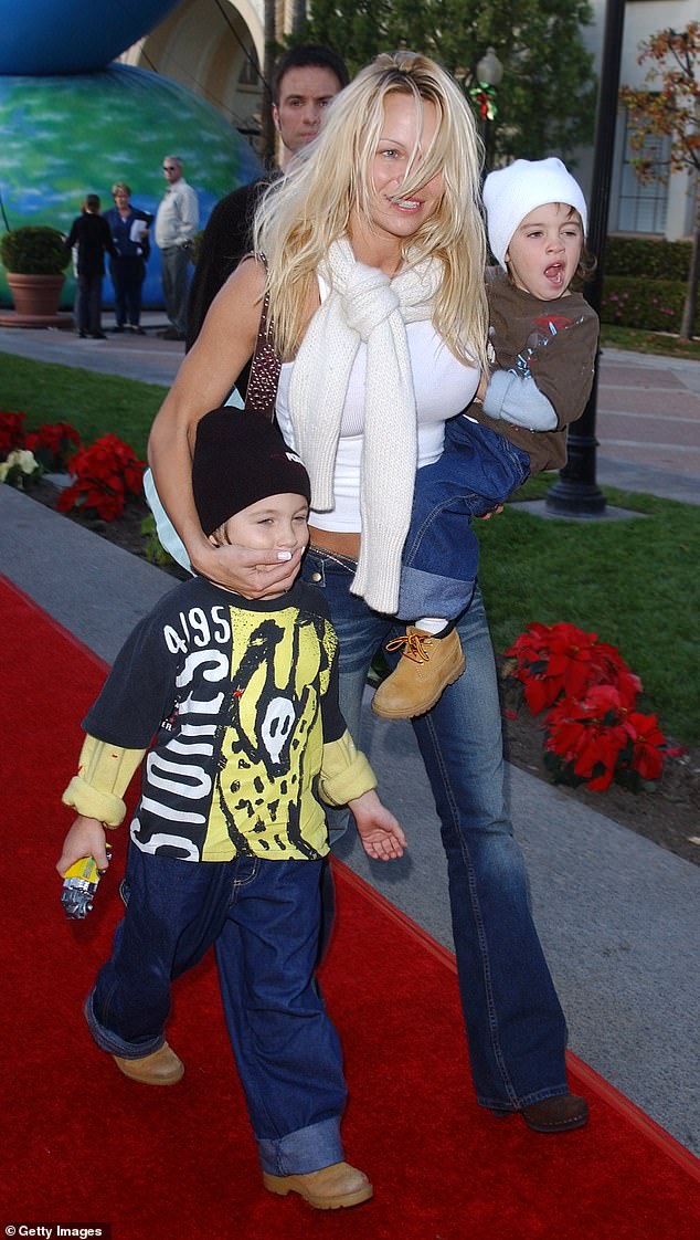 Young mom: Anderson and sons Dylan (L) and Brandon (R) attend the premiere of the animated film Jimmy Neutron: Boy Genius in 2001
