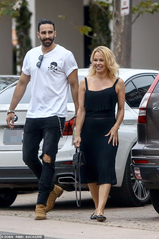 All over now: Pamela was last pictured out with Adil on June 9, where they were seen taking a stroll together in Malibu, California Z