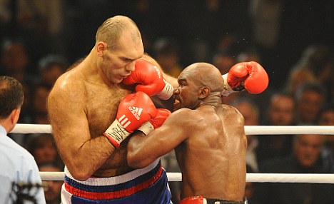 In the ring: Nikolai Valuev in action against Evander Holyfield -at 7ft tall the former heavyweight could be a match for any yeti