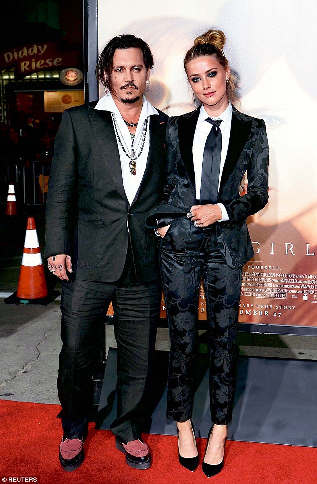 Power couple: Johnny is now married to stunning actress Amber Heard - pictured together earlier in the month