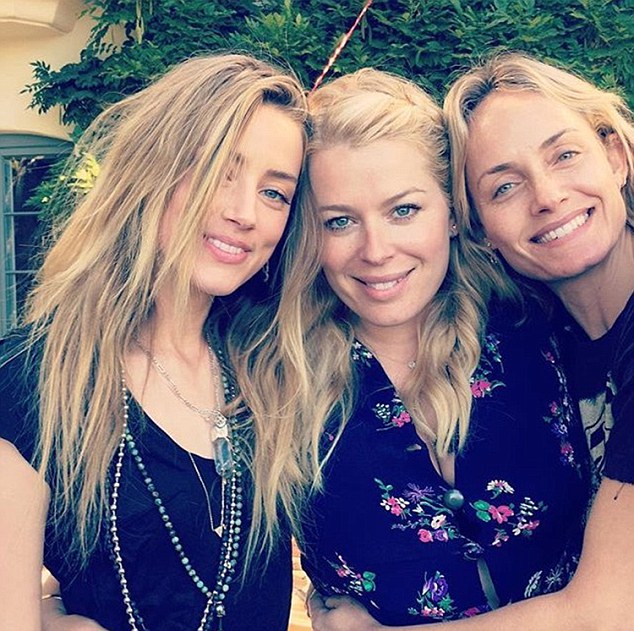 Pictured is Heard (left) at her friend Amanda de Cadenet