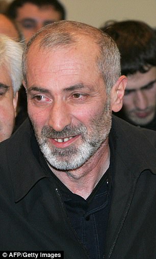 Vitaly Kaloyev smiles as he talks to a media at the airport in Moscow early in November 2007