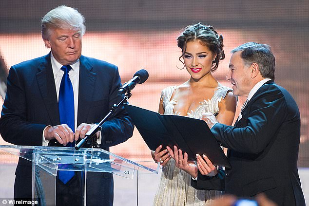 The tycoon reportedly had urged Putin to attend the 2013 Miss Universe Pageant in Moscow to meet Trump (Pictured: Miss Universe 2012 Olivia Culpo and Agalarov onstage)